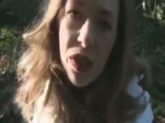 In the park, a light-haired stranger wearing a coat licked my friend's strong knob.